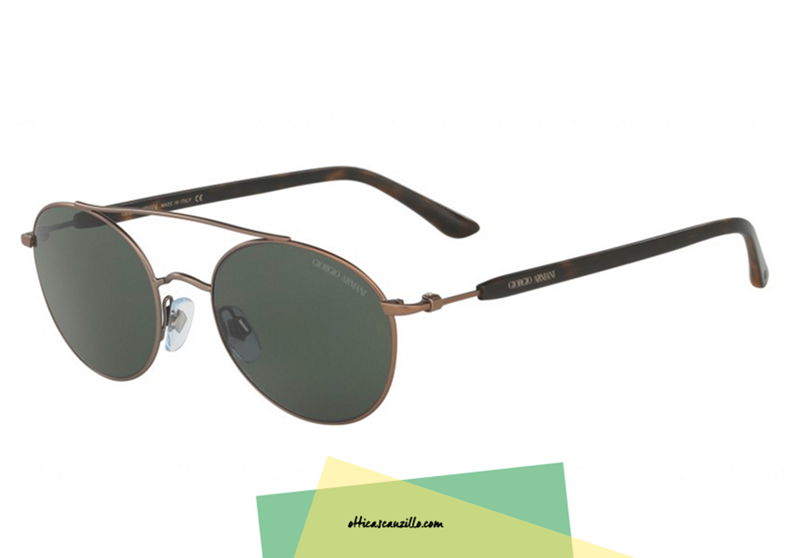 Sunglasses Giorgio Armani FRAMES OF LIFE AR 6038 col. 300671 in perfect vintage style with contemporary mood. Glasses with double bridge and front metal copper color contrasting with full green lenses. unique style for anyone always looking for the maximum. Buy this sunglass Giorgio Armani 6038, the shipping is free in Italy.
