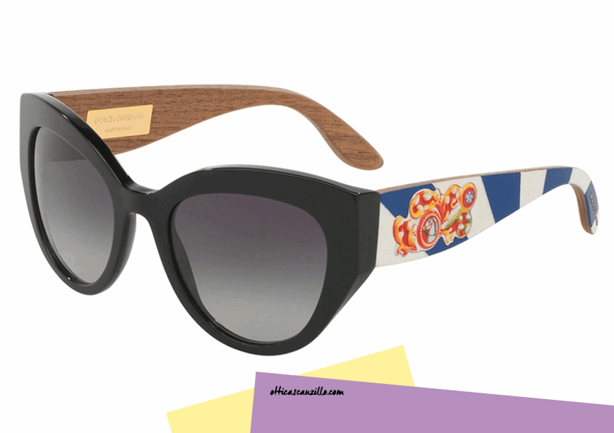 Sunglasses CARRETTO SICILIANO Dolce & Gabbana DG4278 col. 501 / 8G elegant front in black to contrast with the colors of the rods. Accessory handmade in as good Italian tradition. In fact, the wooden rods are hand-painted drawings depicting the typical Sicilian majolica. Purchase this unique accessory Dolce & Gabbana DG4278.