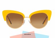 New eyewear collection sunglasses Dolce & Gabbana DG4277 col. 30352L with frame celluloid yellow and internal Sicilian cart multicolor effect. Glasses with dual frame in gilded metal and light brown gradient lenses. Female accessory from butterfly shape that enhances the quirky style.