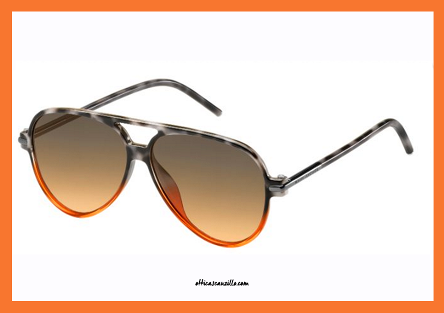 New eyewear collection sunglasses Marc Jacobs 44 / s col. TMLJN frame with thin celluloid in gray shaded in orange havana. Marc Jacobs glasses with next-generation flat lenses in orange shaded gray. Unisex accessory with a casual and modern style. Purchase this sunglasses Marc Jacobs MJ44S, give yourself a trendy accessory.