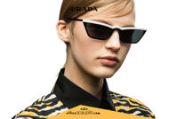 Acquista online su otticascauzillo.com il tuo nuovo occhiale da sole rettangolare stretto acetato PRADA SPR 19U col. nero + bianco